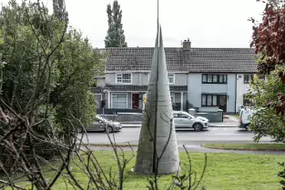 THIS CONE SHAPED OPJECT CAN BE SEEN AT HENNESSEY'S ROAD IN WATERFORD [I COULD NOT ESTABLISH IF IT IS A SCULPTURE]-255541-1
