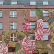FLOWERS ON THE STREET PRODUCED IN 2017 BY LULA GROCE [I PHOTOGRAPHED THIS MURAL IN 2017 AND ITS REPLACEMENT IN AUGUST 2025]-255645-1
