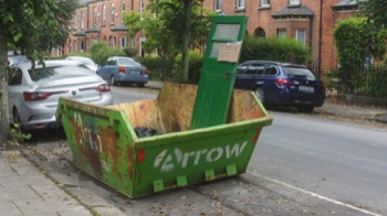  A DOOR IN A SKIP - VOLUNTEERS REQUIRED TO FILL IT 