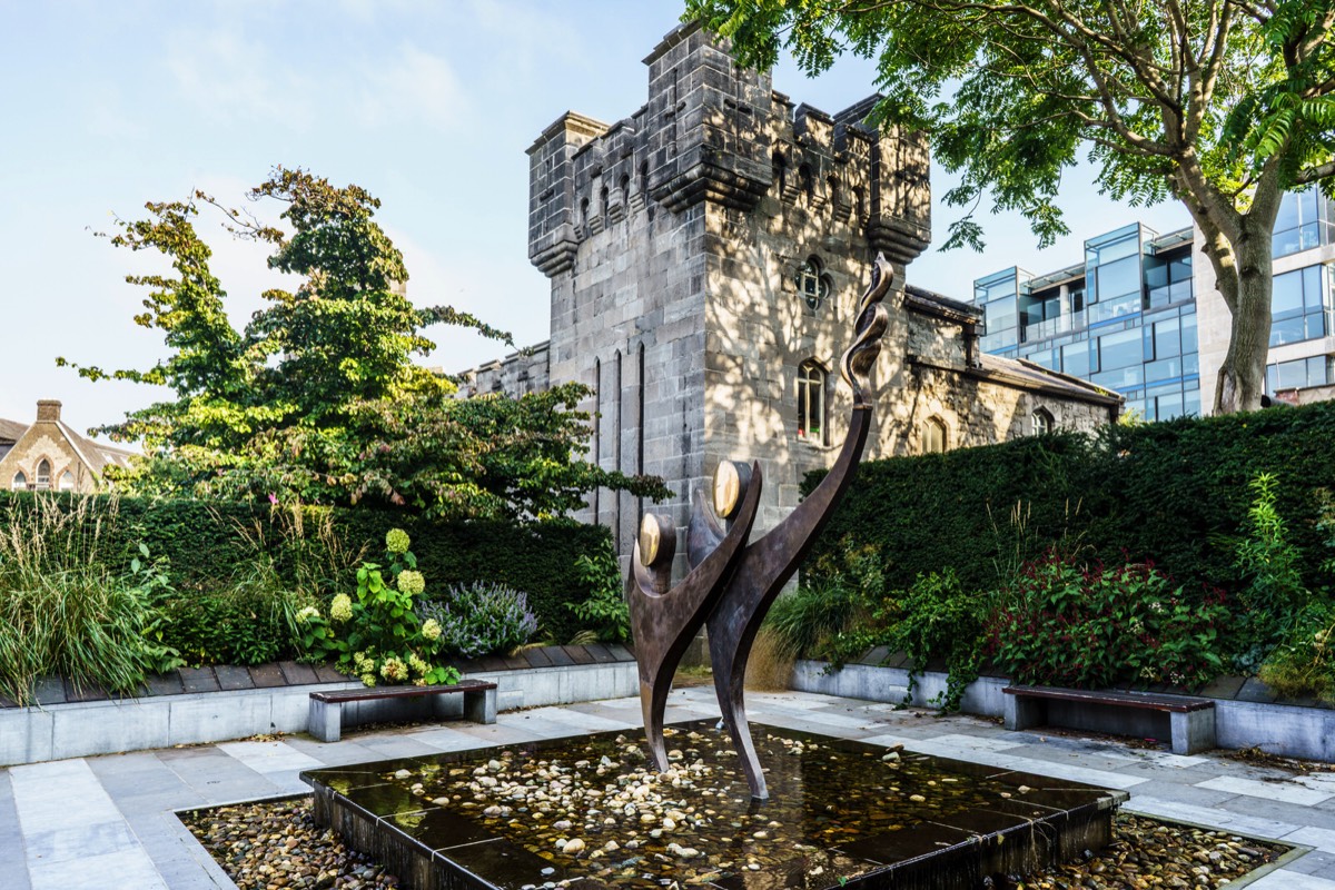 TWO STYLISED FIGURES WITH THE OLYMPIC FLAME - SPECIAL OLYMPICS MEMORIAL BY JOHN BEHAN 003