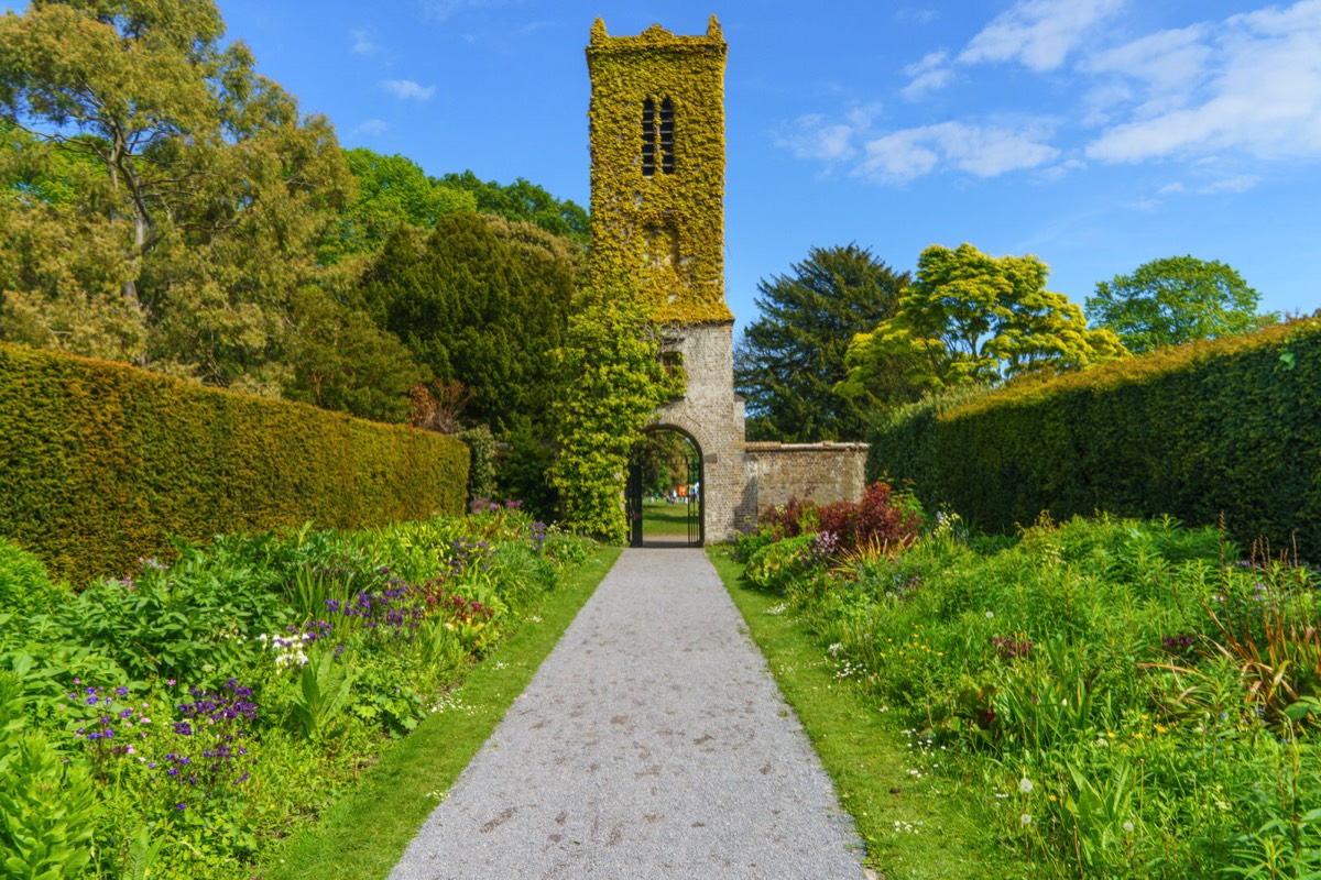 THE CLOCK TOWER IN THE WALLED GARDEN AT SAINT ANNE