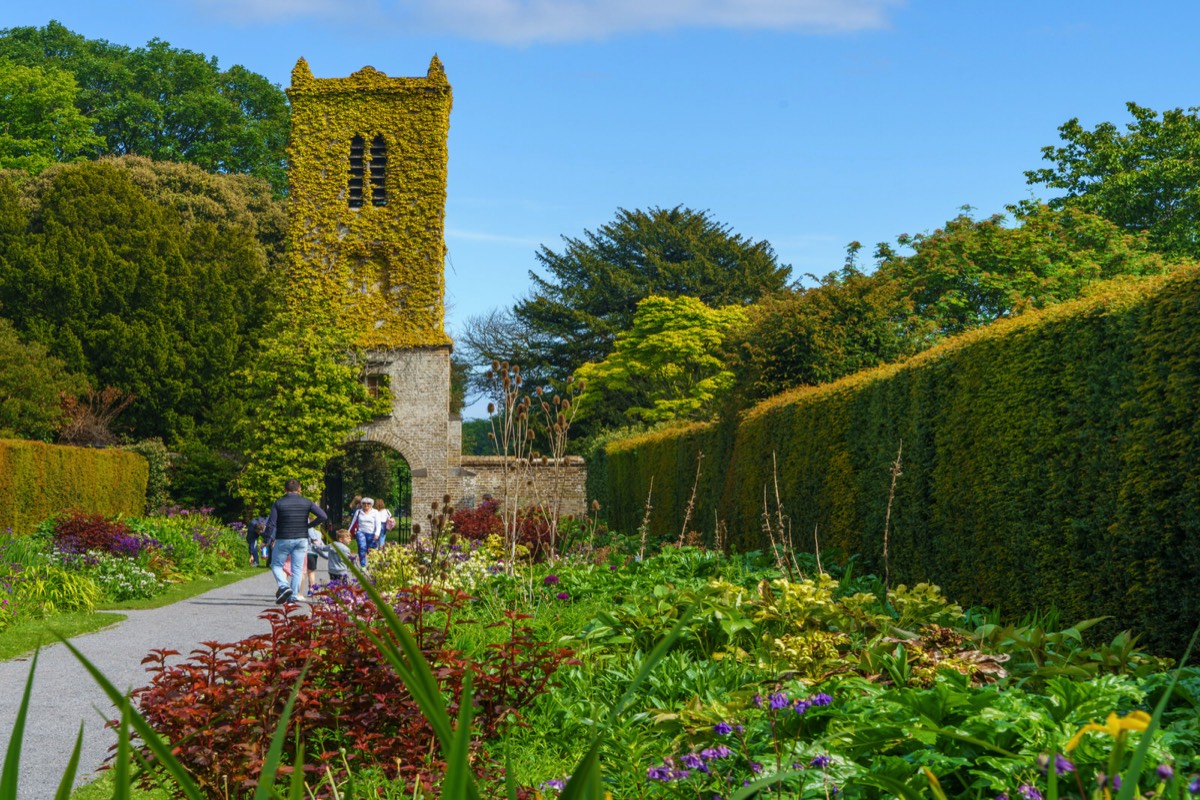 THE CLOCK TOWER IN THE WALLED GARDEN AT SAINT ANNE