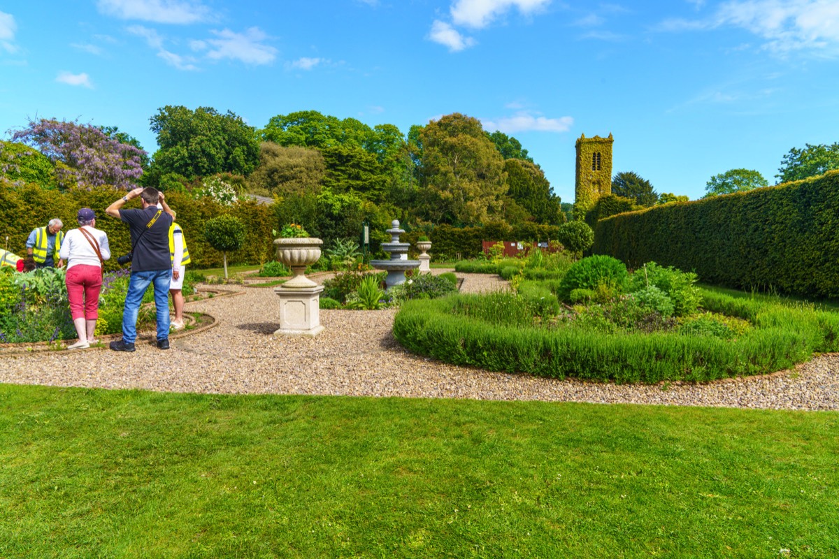 THE CLOCK TOWER IN THE WALLED GARDEN AT SAINT ANNE