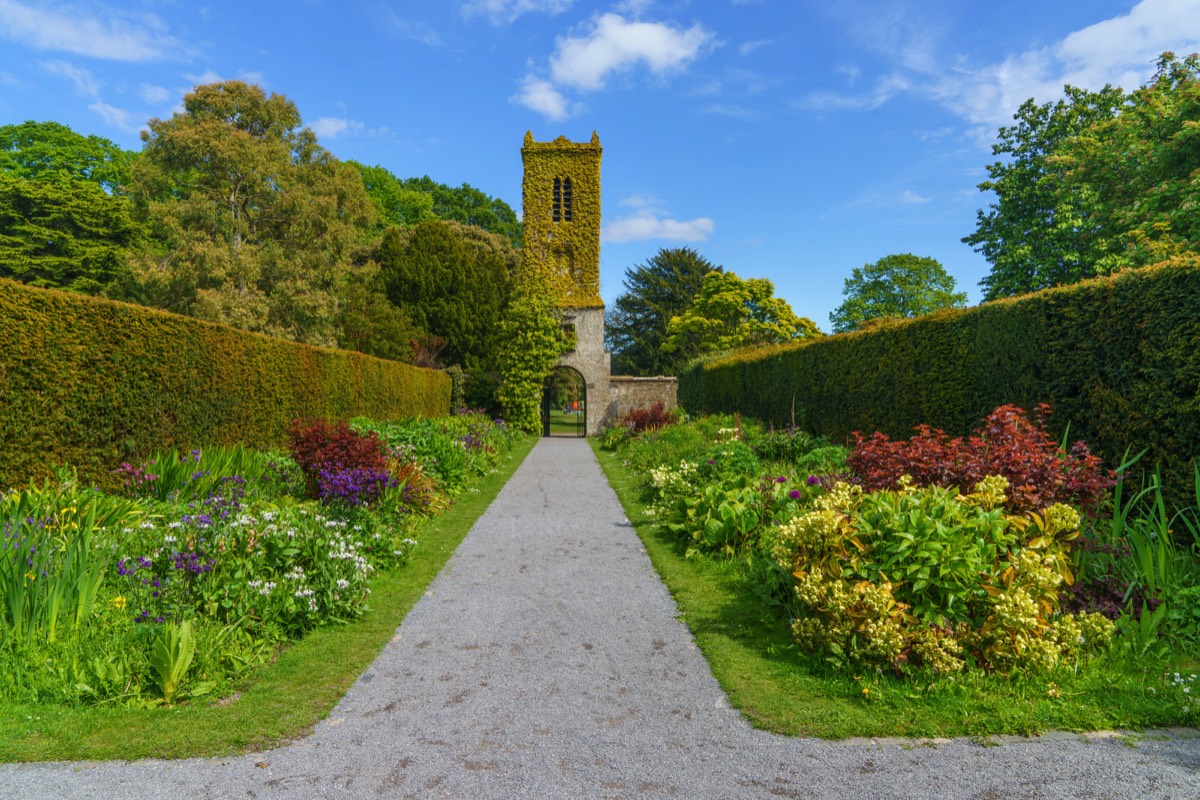 THE CLOCK TOWER IN THE WALLED GARDEN AT SAINT ANNE