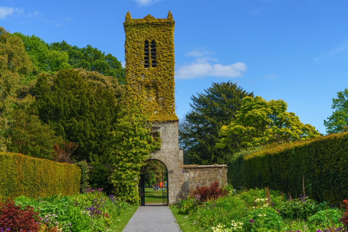 THE CLOCK TOWER IN THE WALLED GARDEN AT SAINT ANNE