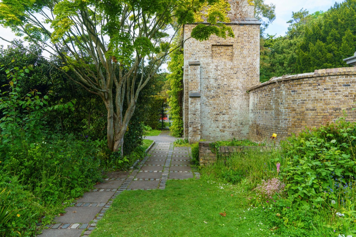 THE CLOCK TOWER IN THE WALLED GARDEN AT SAINT ANNE